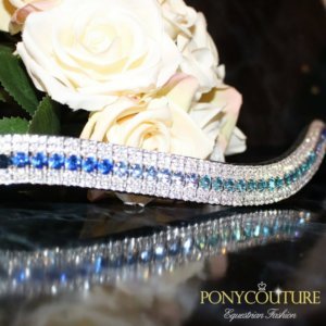 a blue ombre browband that is on sedgwick english leather and with preciosa crystals on a black marble background by ponycouture